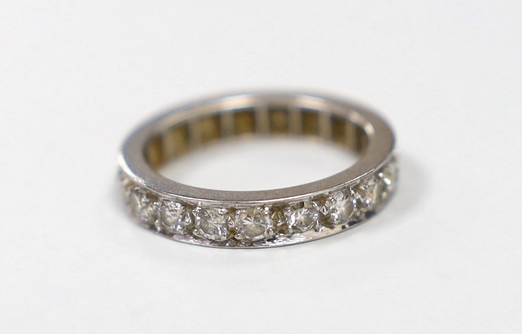 A white metal and diamond set full eternity ring, size J/K, gross weight 4.3 grams.